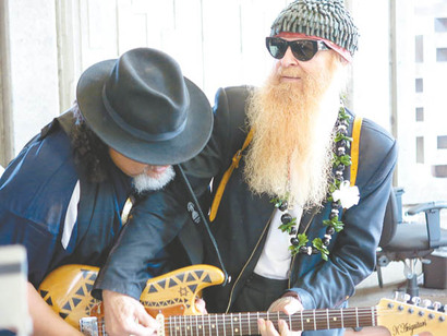 Willie K and Billy F. Gibbons serenade travelers at Kahului Airport.